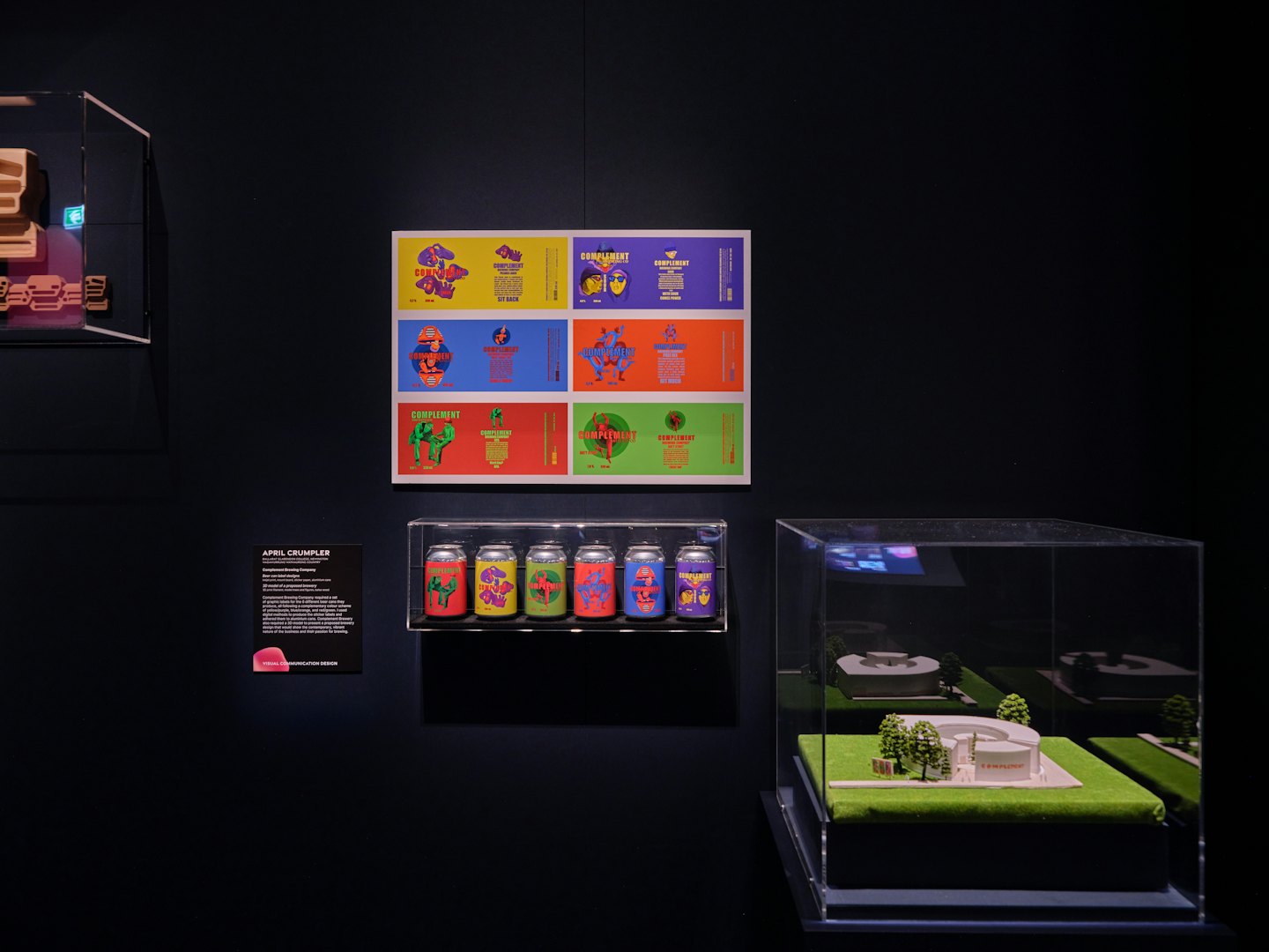 Product labels and beverage cans displayed with an architectural model.
